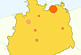 Auf diesem Bild sieht man eine Deutschlandkarte. Ein besonders großer Kreis ist auf Rostock eingezeichnet.